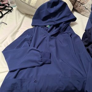 Hooded long sleeve scrub jacket